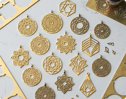 Intricate laser cut geometric pendant samples